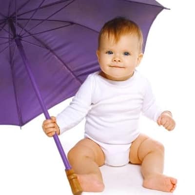 cute baby holding an umbrella