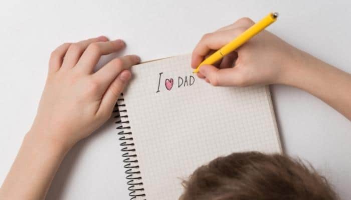 child writing a letter to dad for father's day