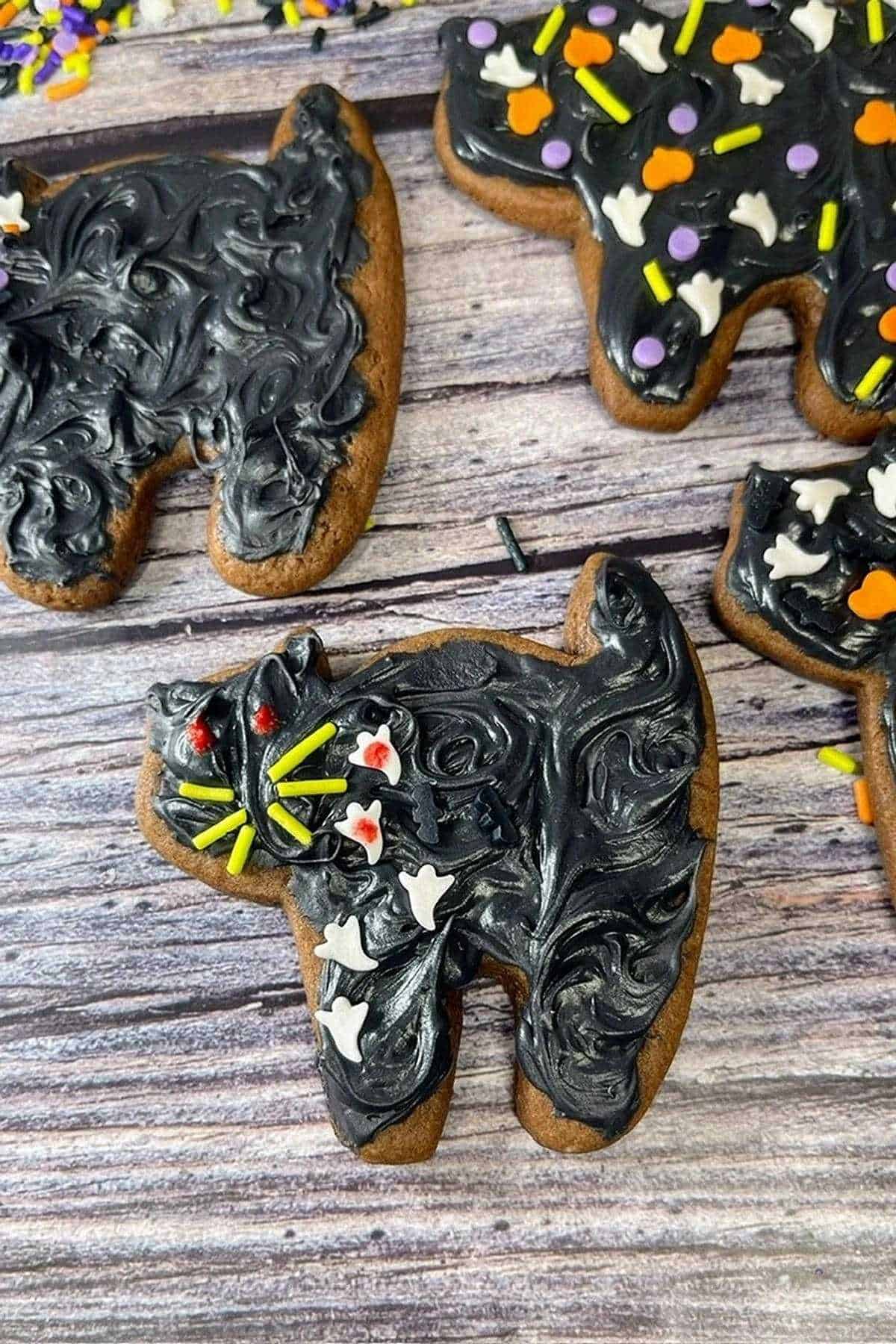 Cut out black cat cookies for Hocus Pocus themed party.