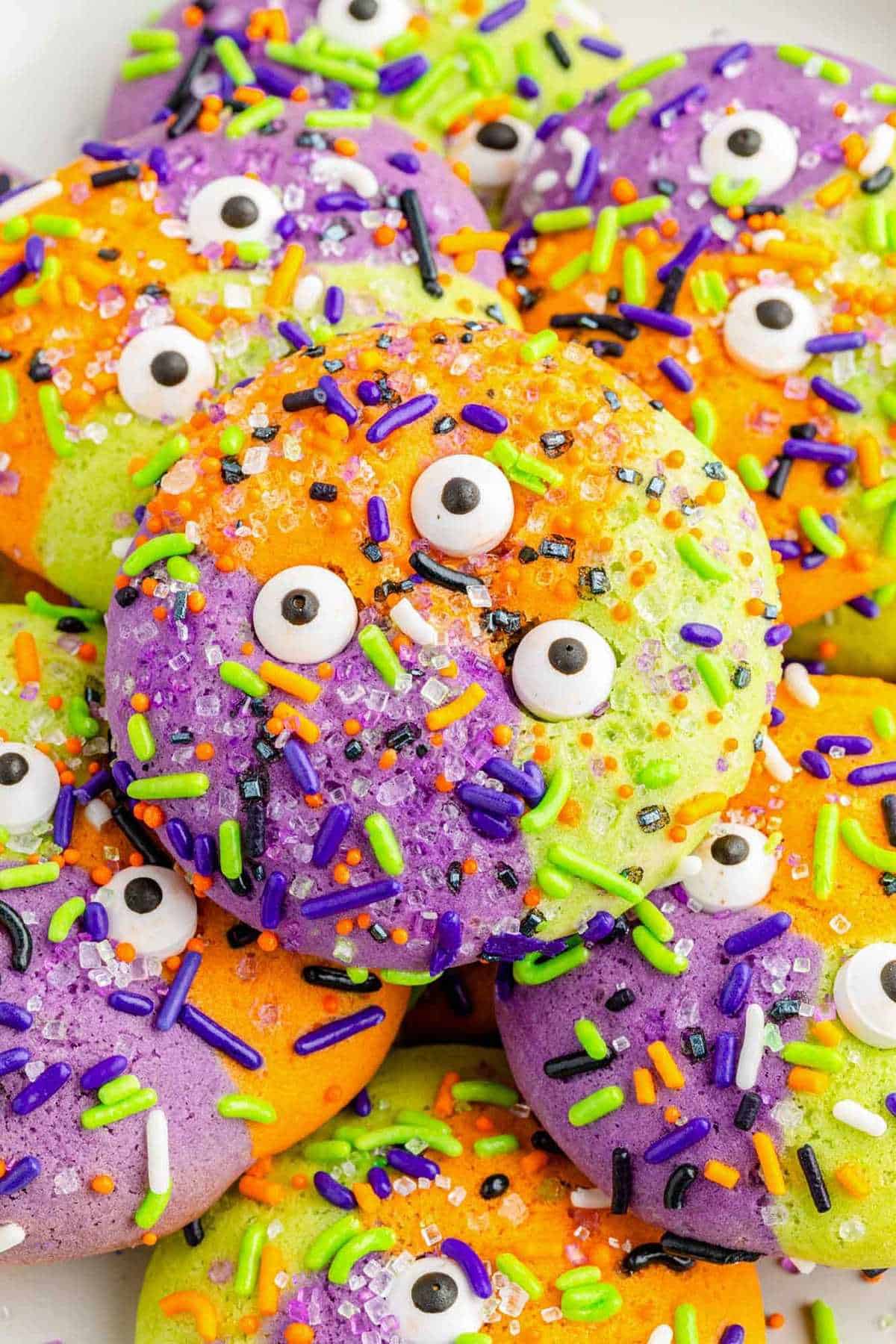 A plate of monster cookies with hocus pocus decorations.