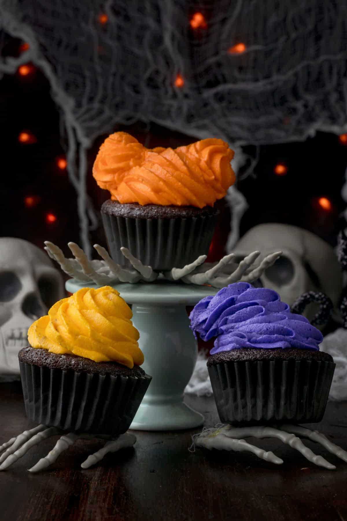 Sanderson sisters cupcakes featuring skeletons and skulls, perfect for hocus pocus themed snack ideas.
