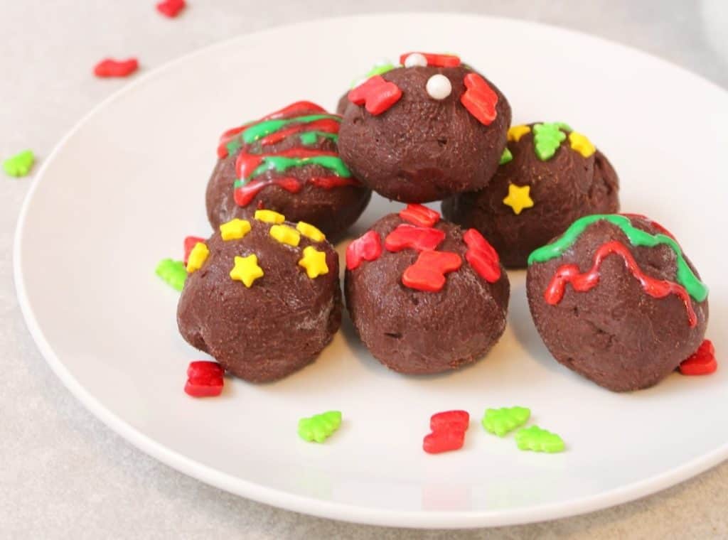 Christmas truffles on a white plate.