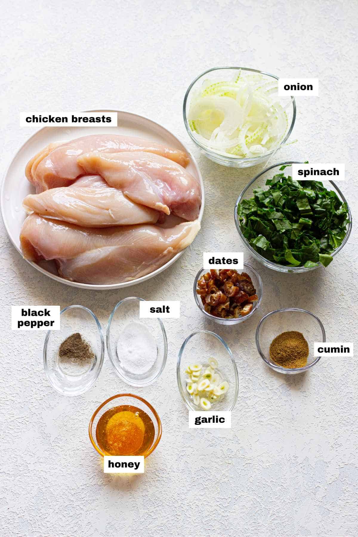 The ingredients for chicken breasts stuffed with spinach. 
