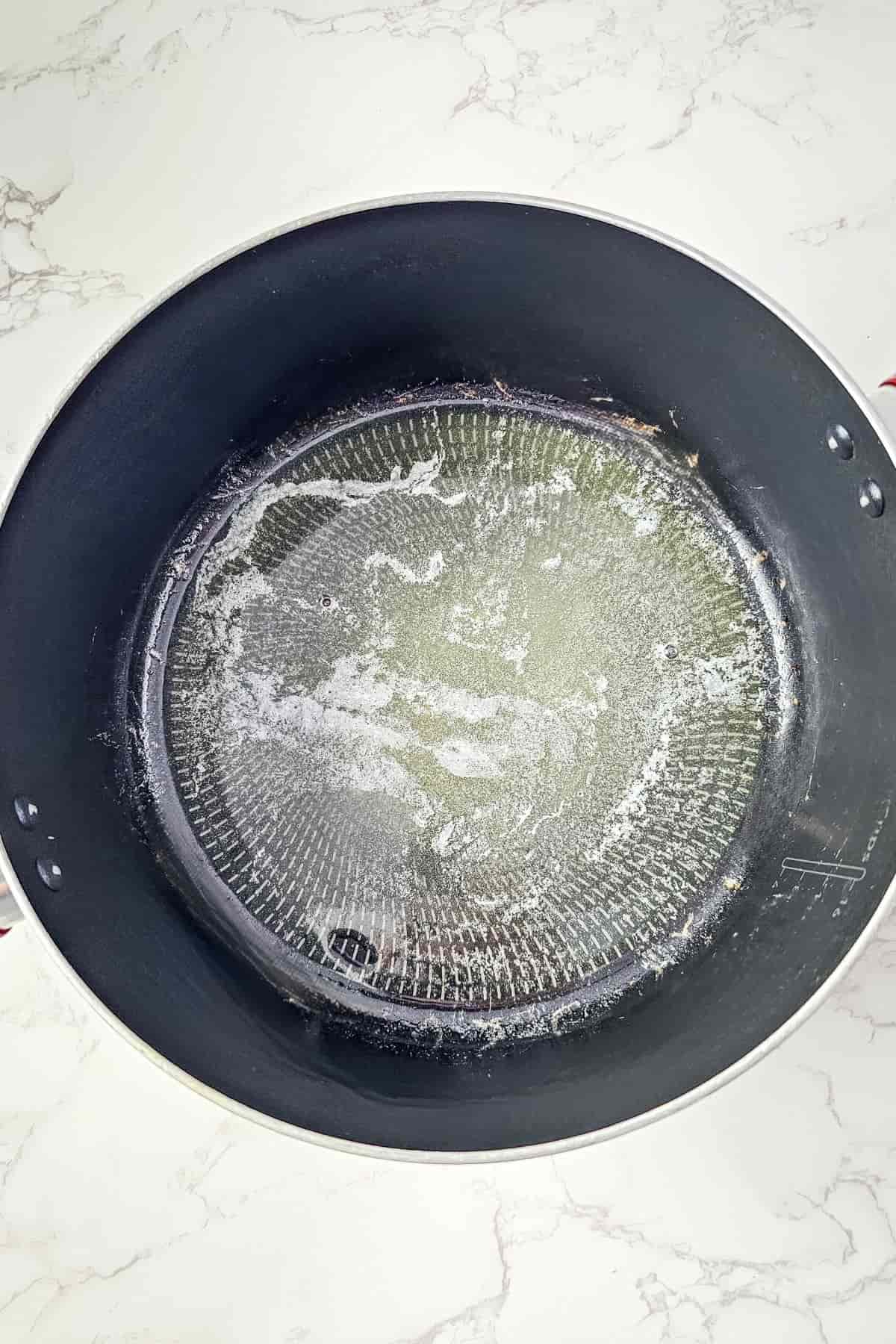 Melted butter on a large pan.