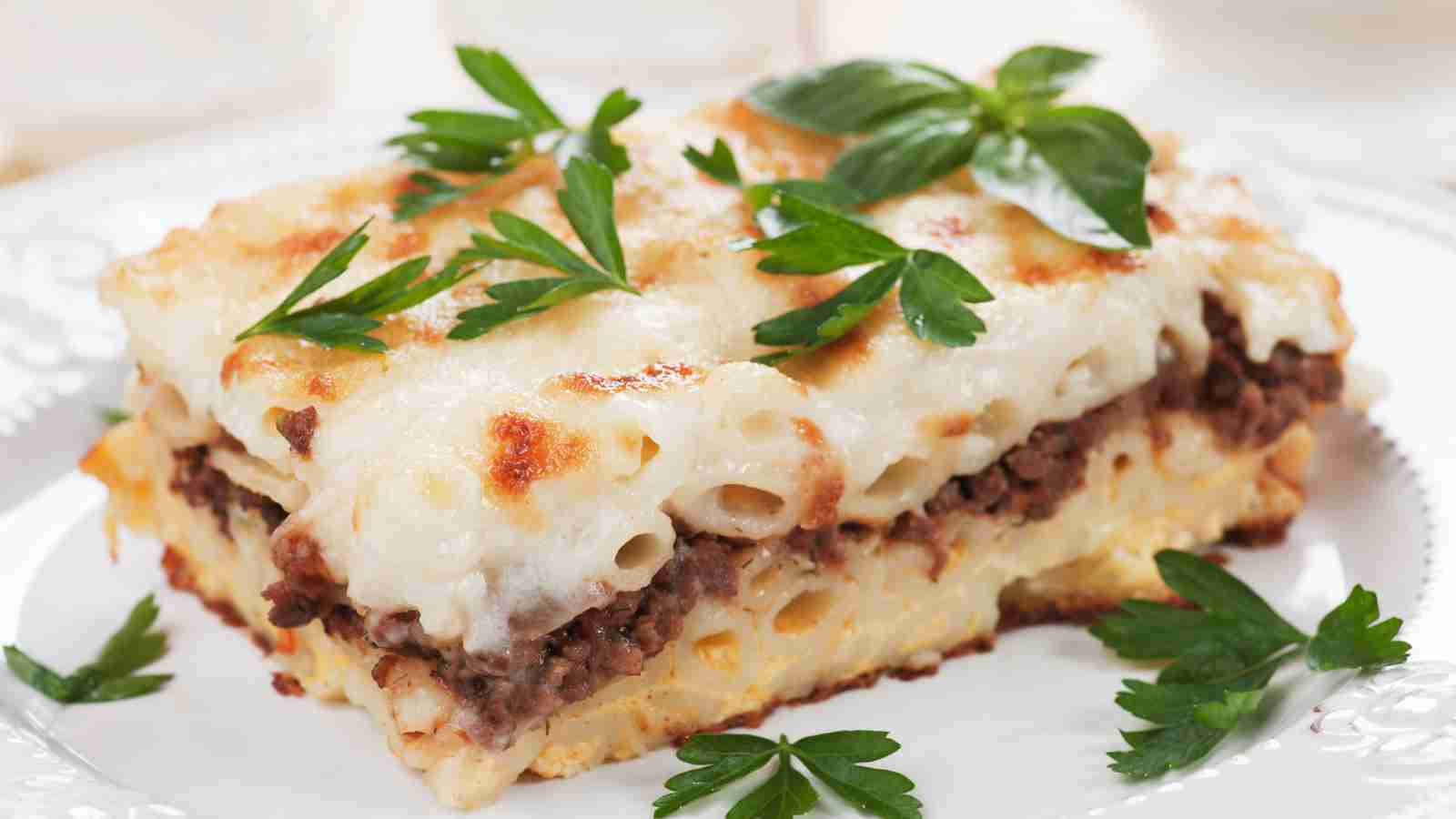 A plate of lasagna with béchamel sauce.