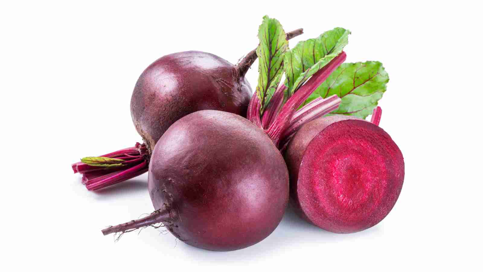 Three whole beets and one beet cut in half.