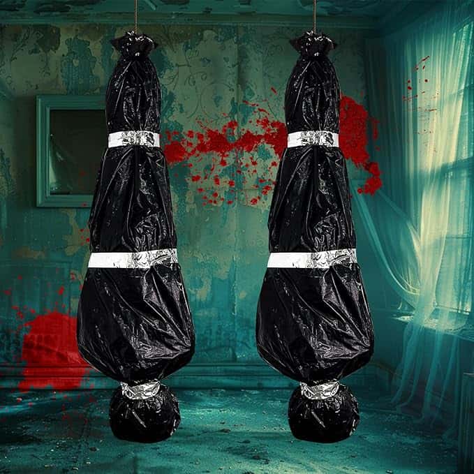 Two large black plastic bags are suspended from the ceiling with silver tape securing their contents.
