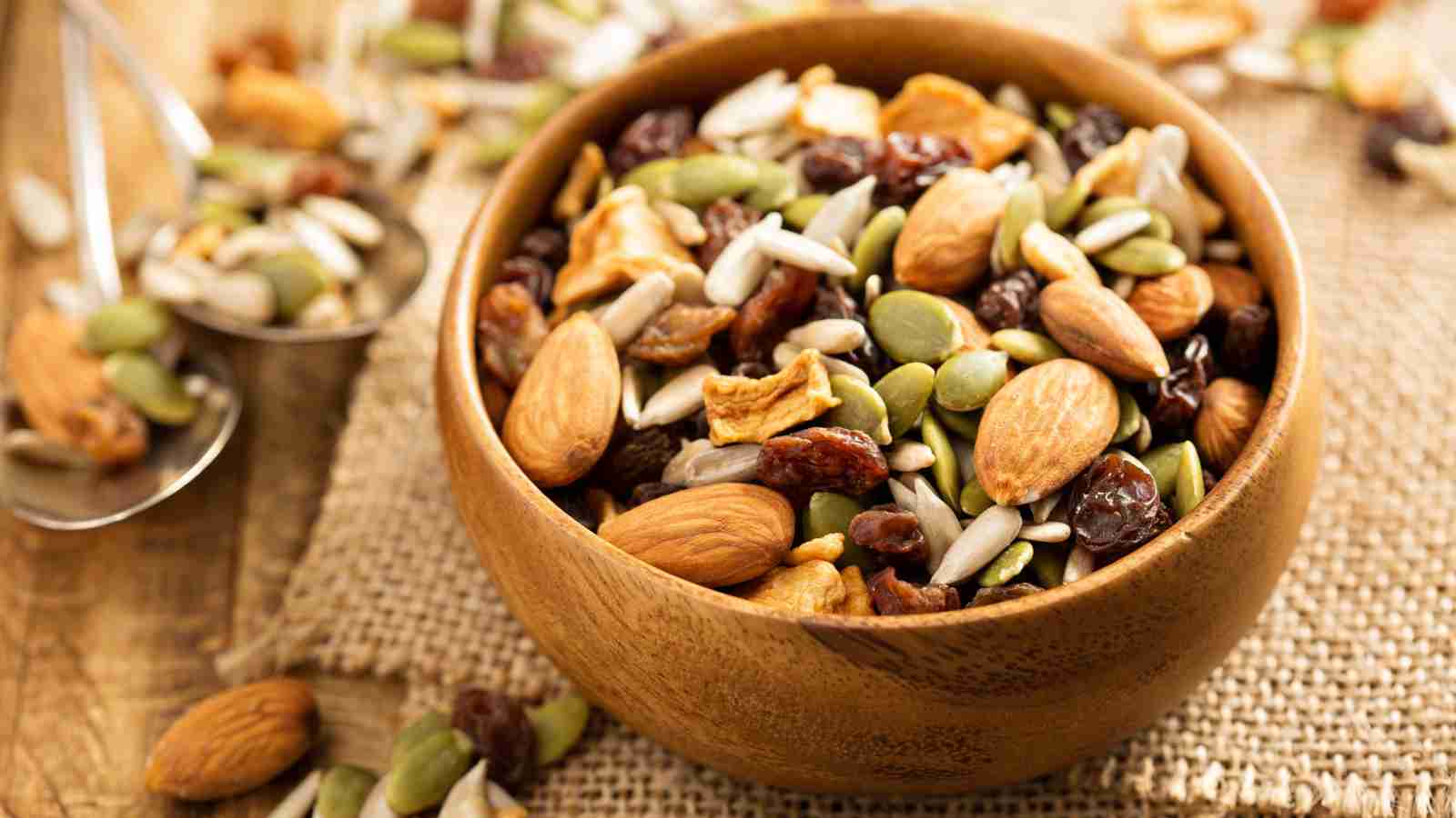 A bowl of mixed nuts and seeds.
