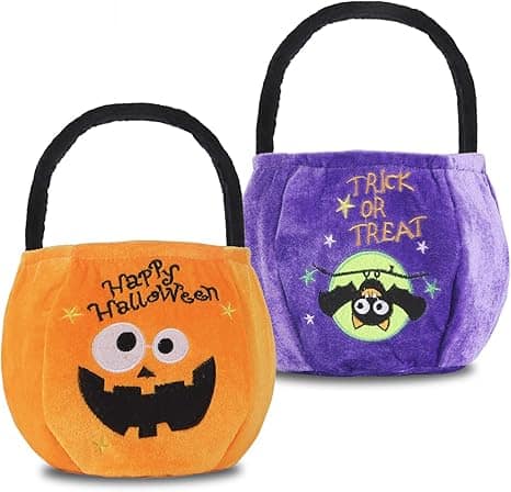 Two Halloween-themed fabric bags with handles: one orange with a pumpkin face and "Happy Halloween," and one purple with a bat and "Trick or Treat.