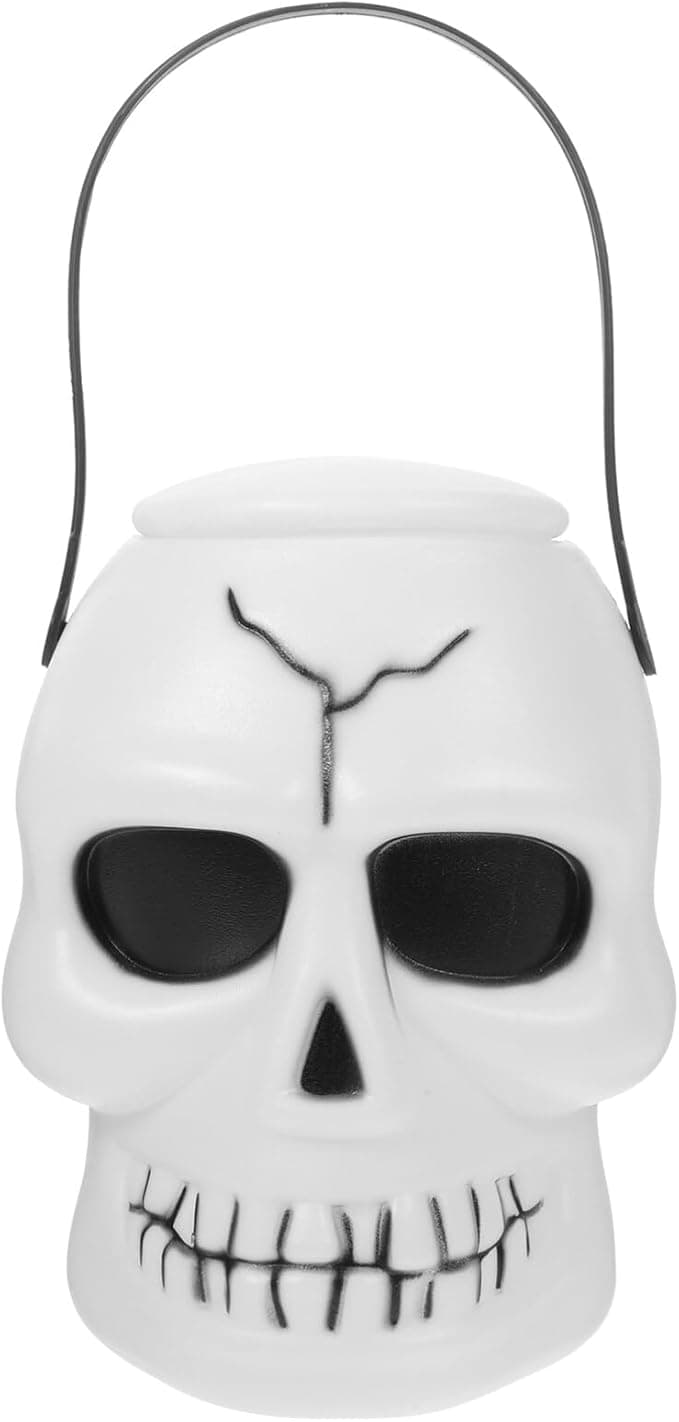 A white skull-shaped plastic pail with black eye and nose features, and a metal handle.
