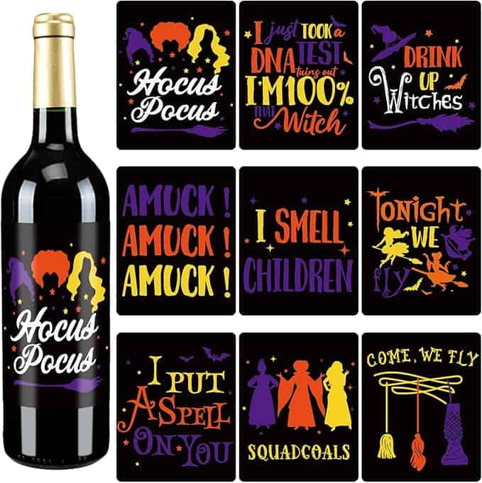 A bottle of wine with text "Hocus Pocus" and various Halloween-themed coaster designs featuring colorful witch-related illustrations and quotes.