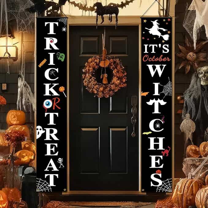 Front porch with Halloween decorations, including banners reading "Trick or Treat".