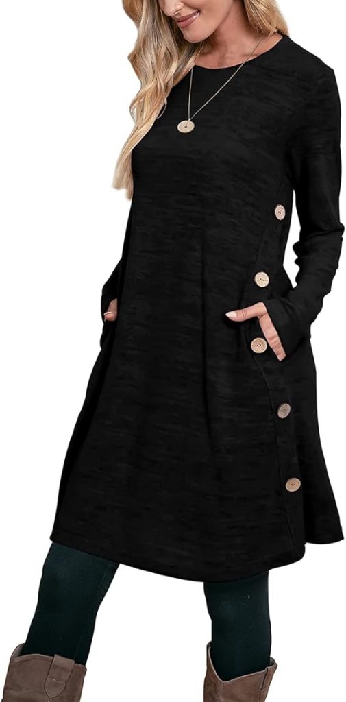 A person wearing a long-sleeve black dress with side buttons, hands in pockets, paired with green leggings and brown boots.