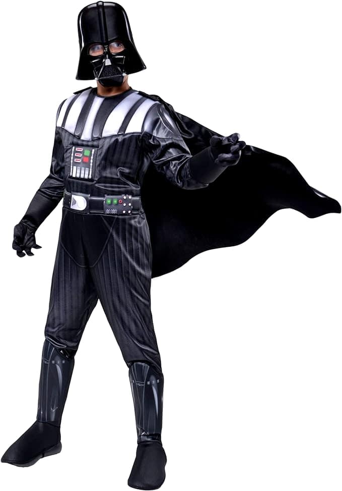A person dressed in a black costume with a cape and helmet, resembling a well-known sci-fi character.