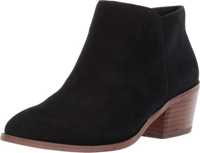 A black suede ankle boot with a brown low heel, viewed from the side.