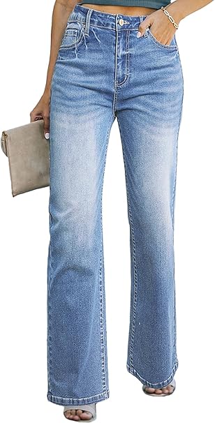 A person wears high-waisted, wide-leg blue jeans, holding a beige clutch.