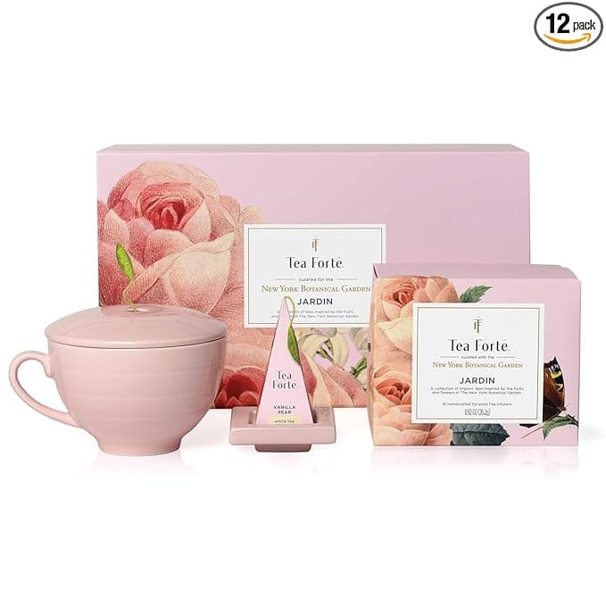 Tea Forte gift set includes a pink teacup with lid, tea infuser, and Jardin tea box, all in a floral-themed packaging.