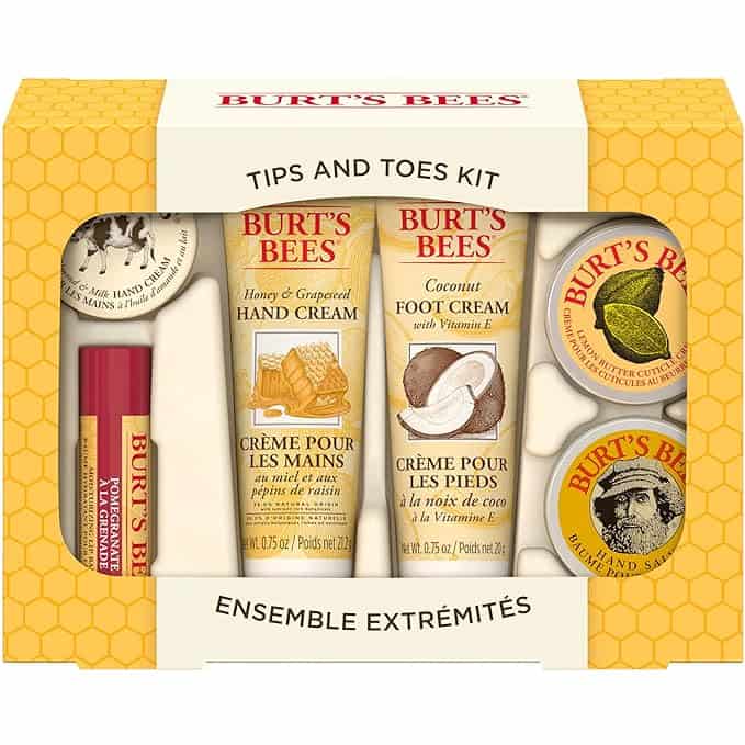 A Burt's Bees Tips and Toes Kit with various hand and foot care products, including creams, salve, and lip balm, all in yellow and red packaging.