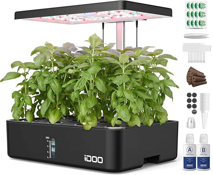 Indoor hydroponic garden kit with LED light, featuring basil plants. Includes nutrient solutions, seed pods, and small accessories.