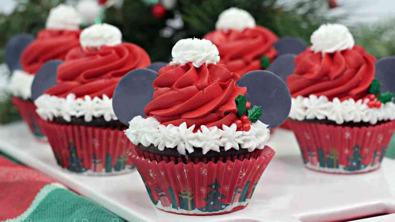 Mickey Ears Santa Cupcakes with red and white frosting.