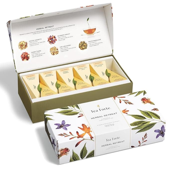 Tea Forte Herbal Retreat collection with five pyramid-shaped tea infusers in an illustrated floral box. Lid displays images and descriptions of tea varieties.