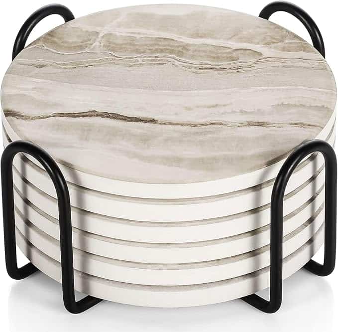 Stack of round marble coasters in a black metal holder.