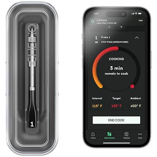 A smart cooking thermometer probe next to a smartphone displaying a cooking app.