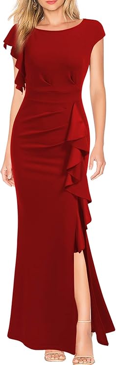A woman wearing a red, floor-length, cap-sleeve dress with ruffle detailing and a side slit.