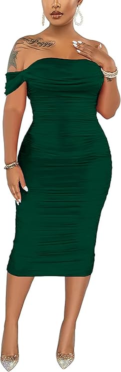 Person in a form-fitting, off-shoulder green dress, wearing heels.