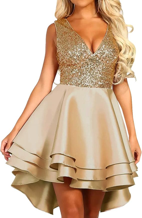 A woman in a sleeveless gold dress with a glittery bodice and layered satin skirt.
