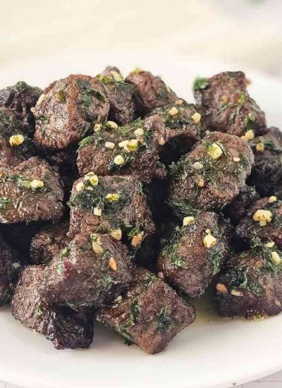 A plate of tender and juicy air fryer steak bites.
