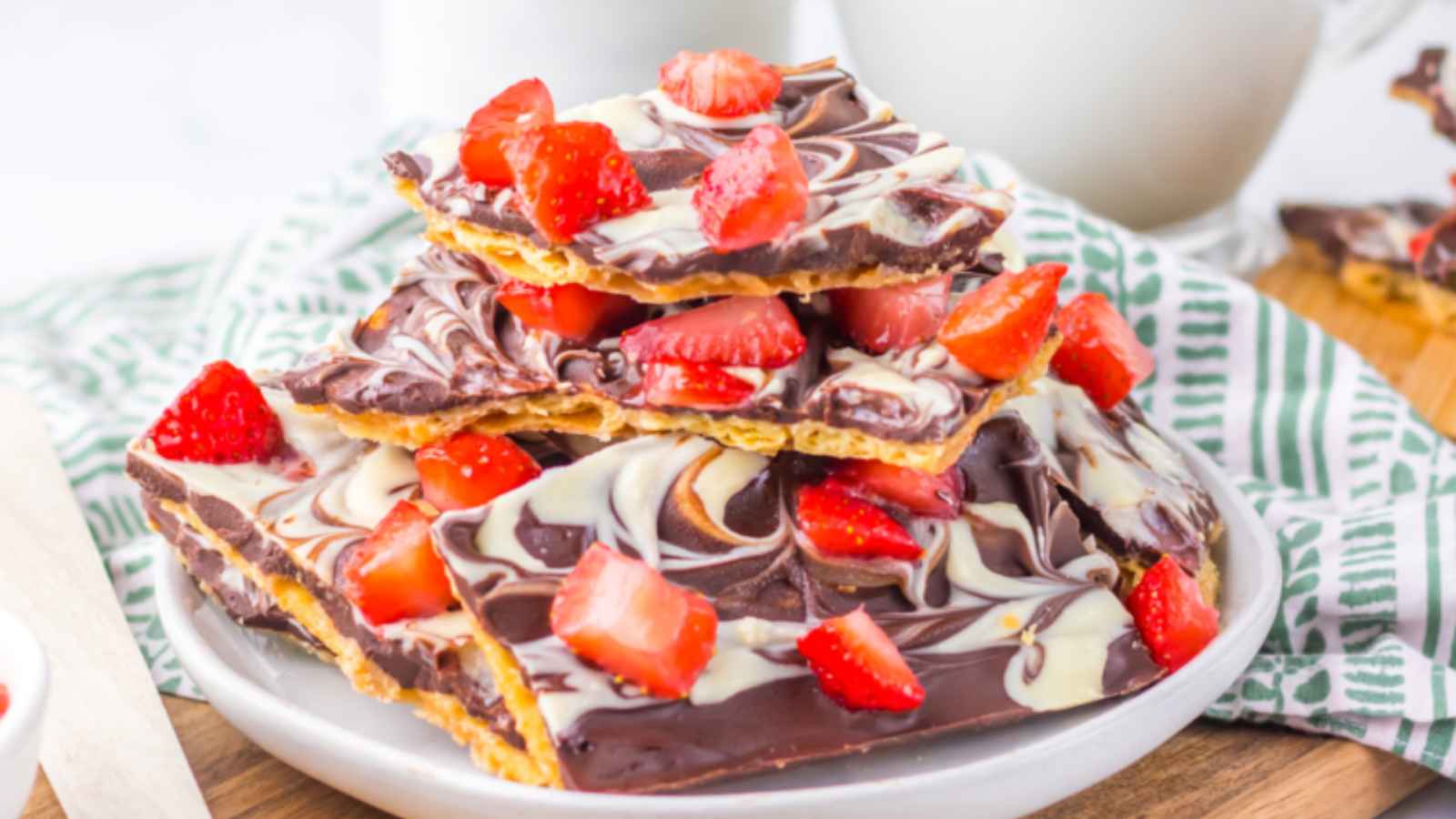 Chocolate Covered Strawberry Bark with a glossy chocolate coating and fresh diced strawberries sprinkled on top.