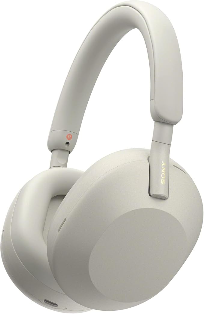 A pair of light gray over-ear headphones with a sleek design and cushioned ear cups.