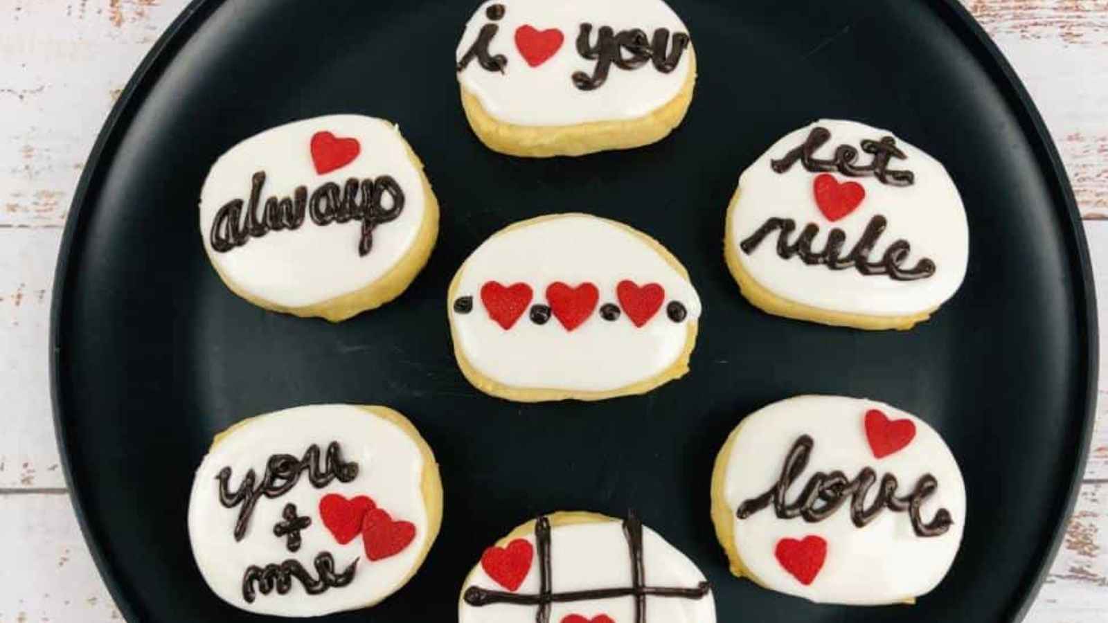 Plate with cookies decorated with phrases like 