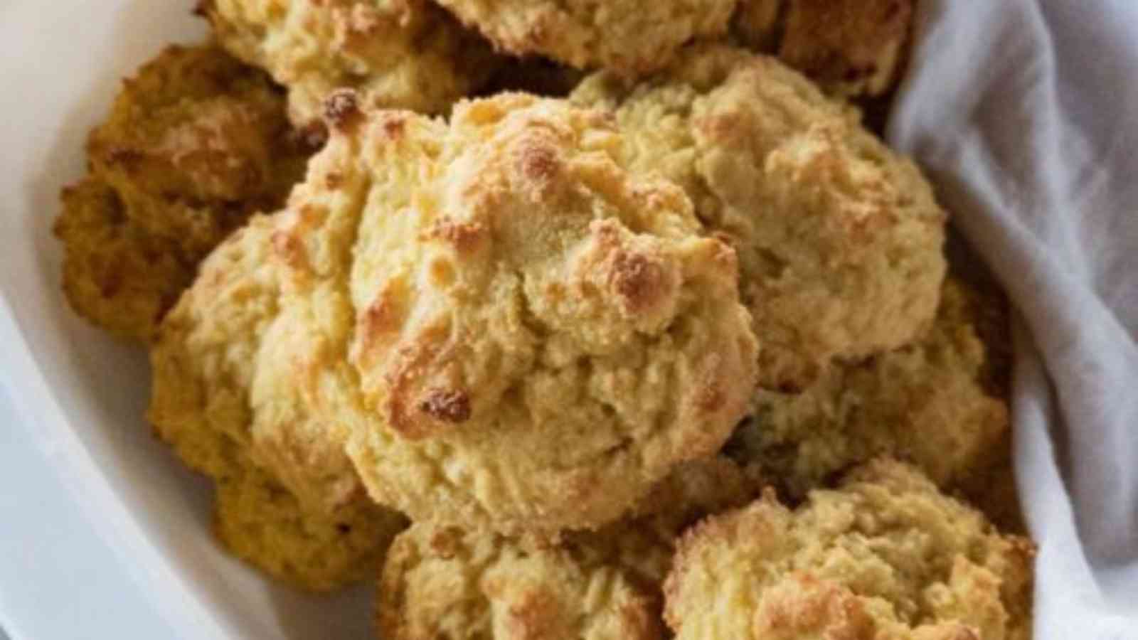 Drop Biscuits with Buttermilk on a white baking dish with white cloth.