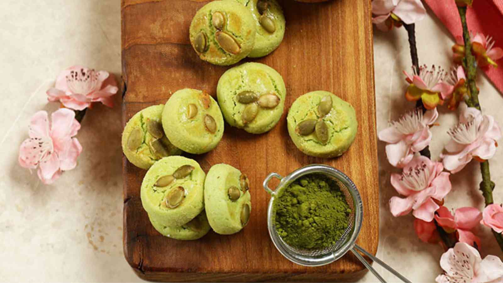 Matcha Sugar Cookies on a wooden board.