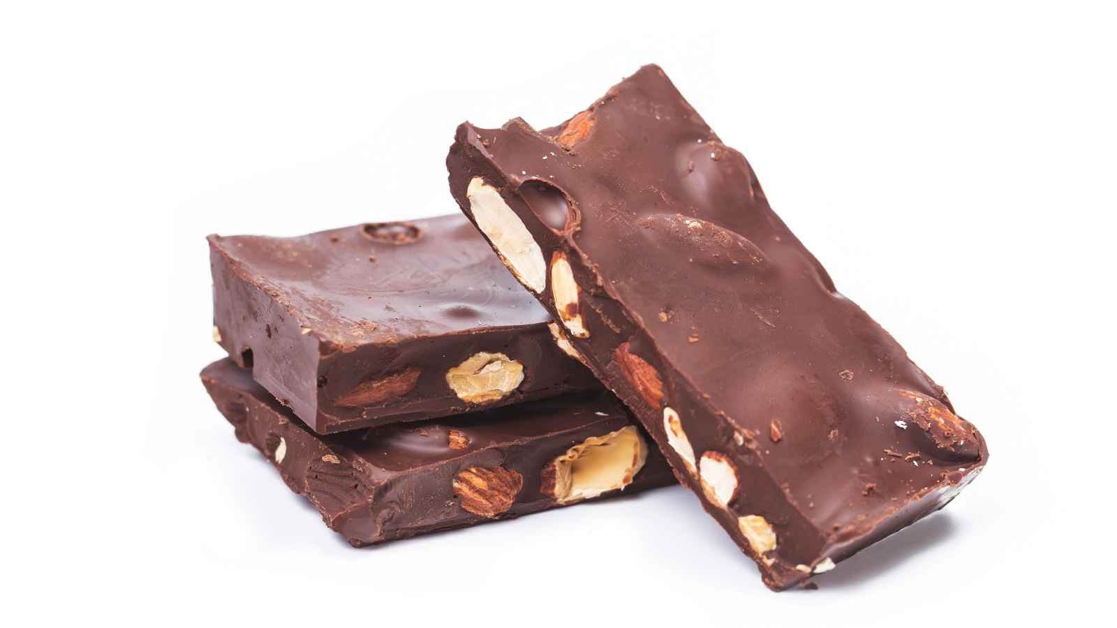 Three stacked chocolate bars with visible nuts, set against a white background.