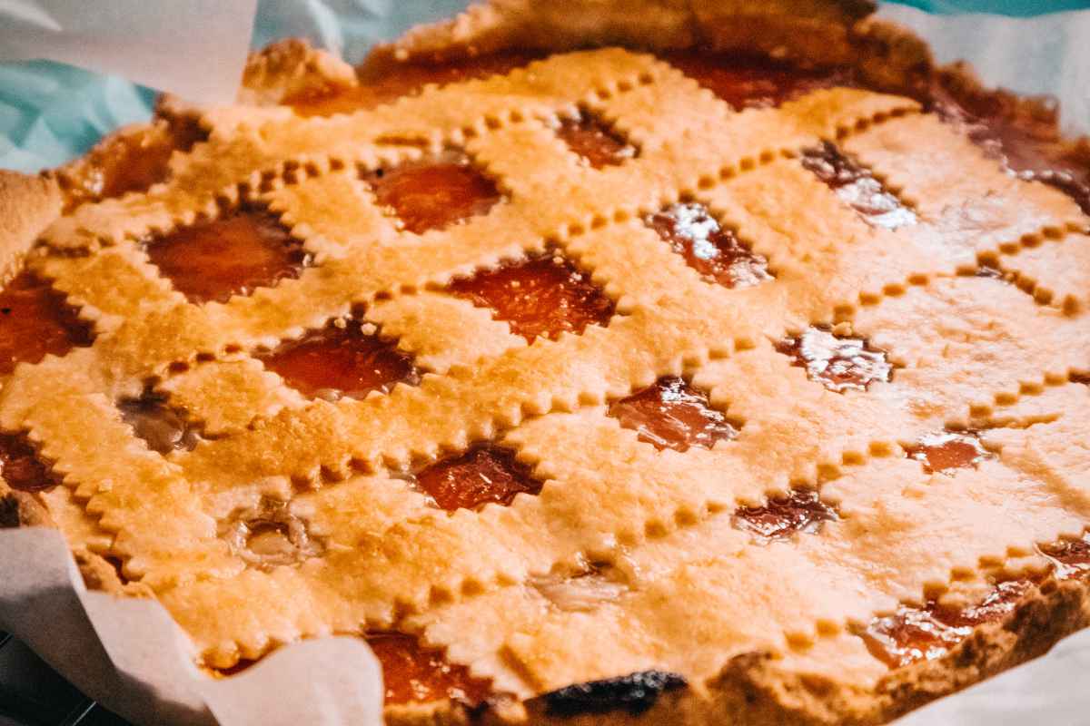 A close-up of a baked pie with a golden lattice crust.