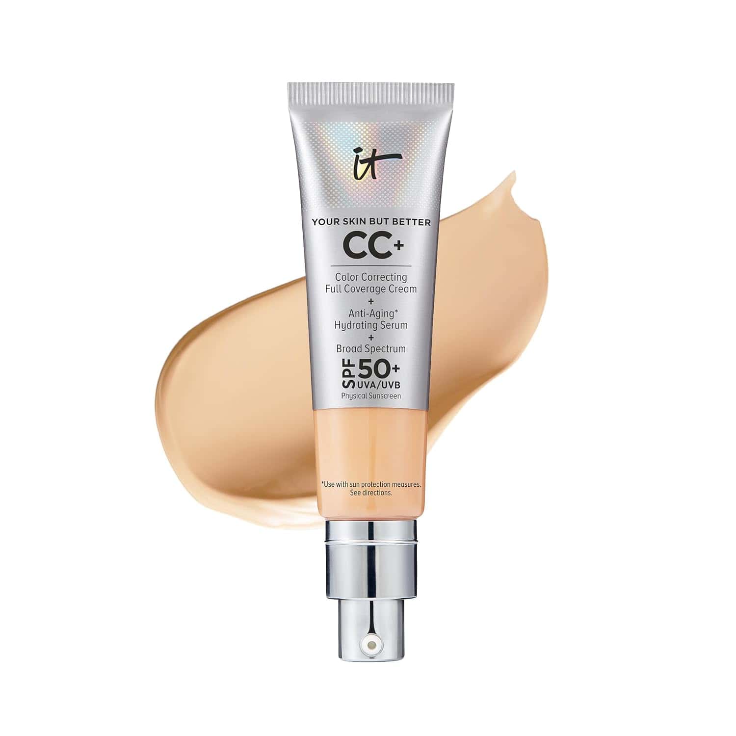 A tube of IT Cosmetics CC+ cream with SPF 50+ is shown in front of a beige cream smear.