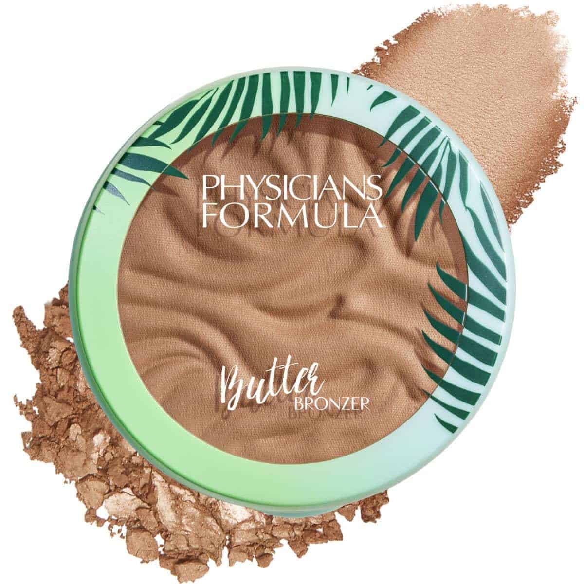 A round Physicians Formula Butter Bronzer compact with a green palm leaf design, shown next to a smear of the bronzer powder.