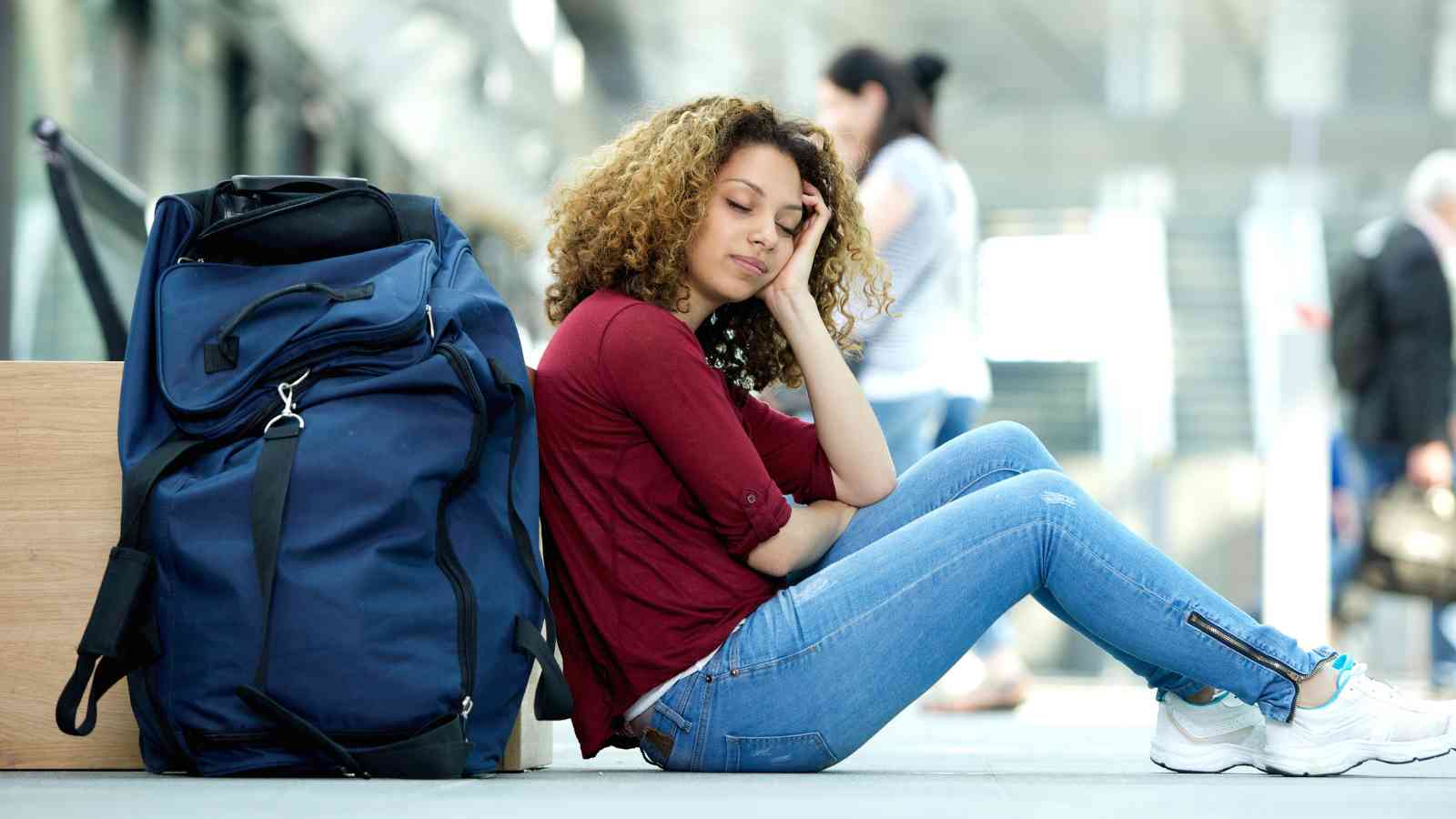 A woman in an airport resting.