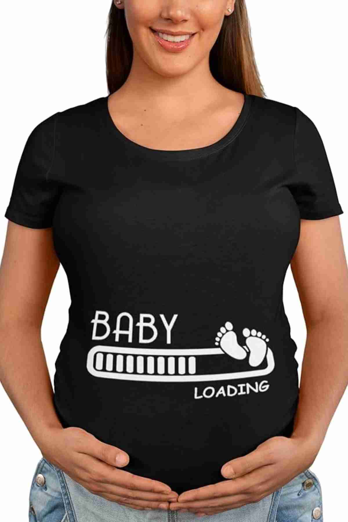 Pregnant woman wearing a black t-shirt with a progress bar and the words "Baby Loading" printed on it, holding her hands on her belly.