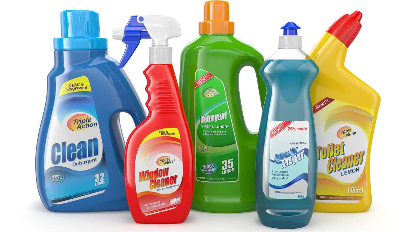 Five different bottles of cleaning products are arranged together, including detergent, window cleaner, and toilet bowl cleaner.