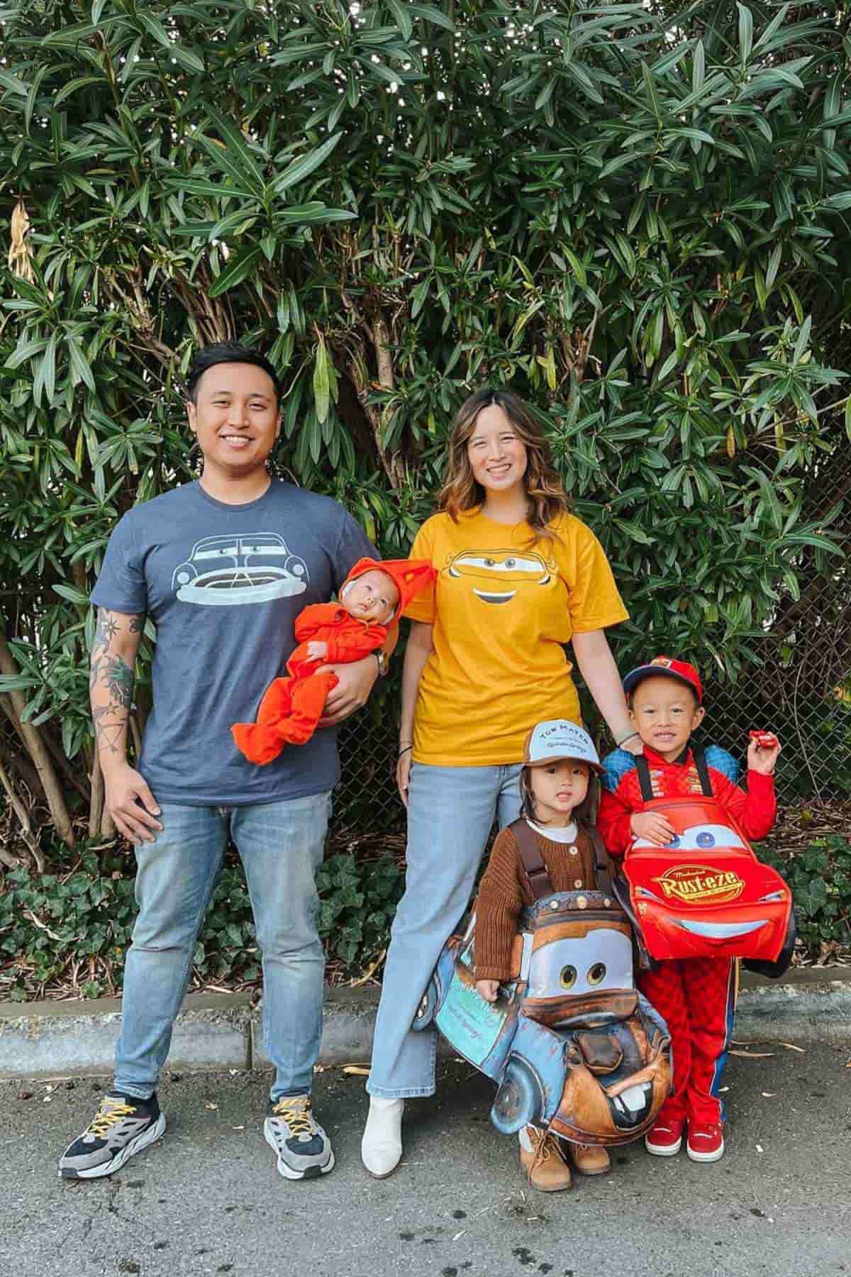 A family of five wearing wearing costumes inspired by the characters in "Cars" movie.