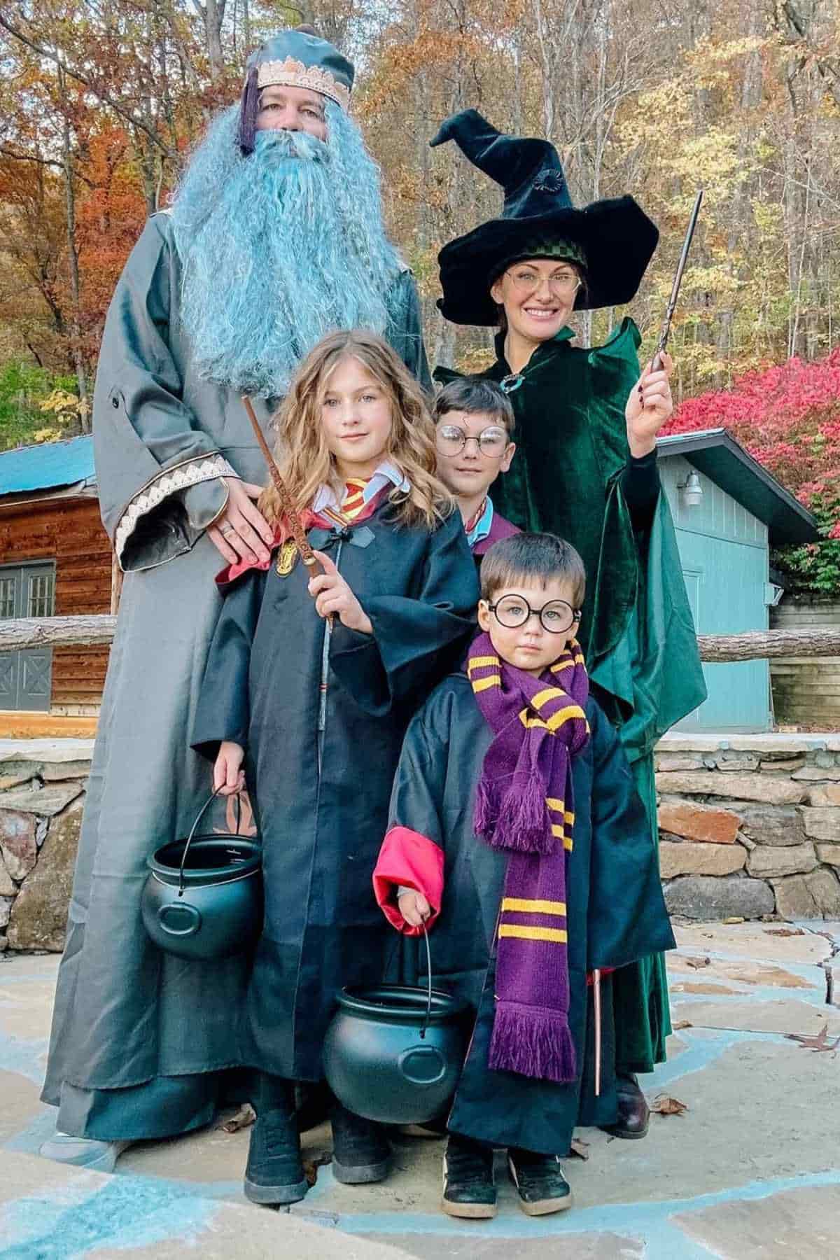 A family of five wearing costumes inspired by Harry Potter's characters.