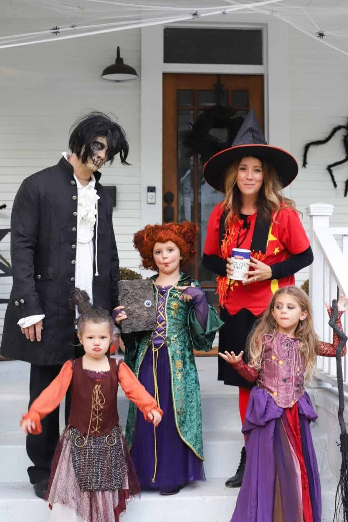 A family of five wearing Hocus Pocus-inspired costumes.