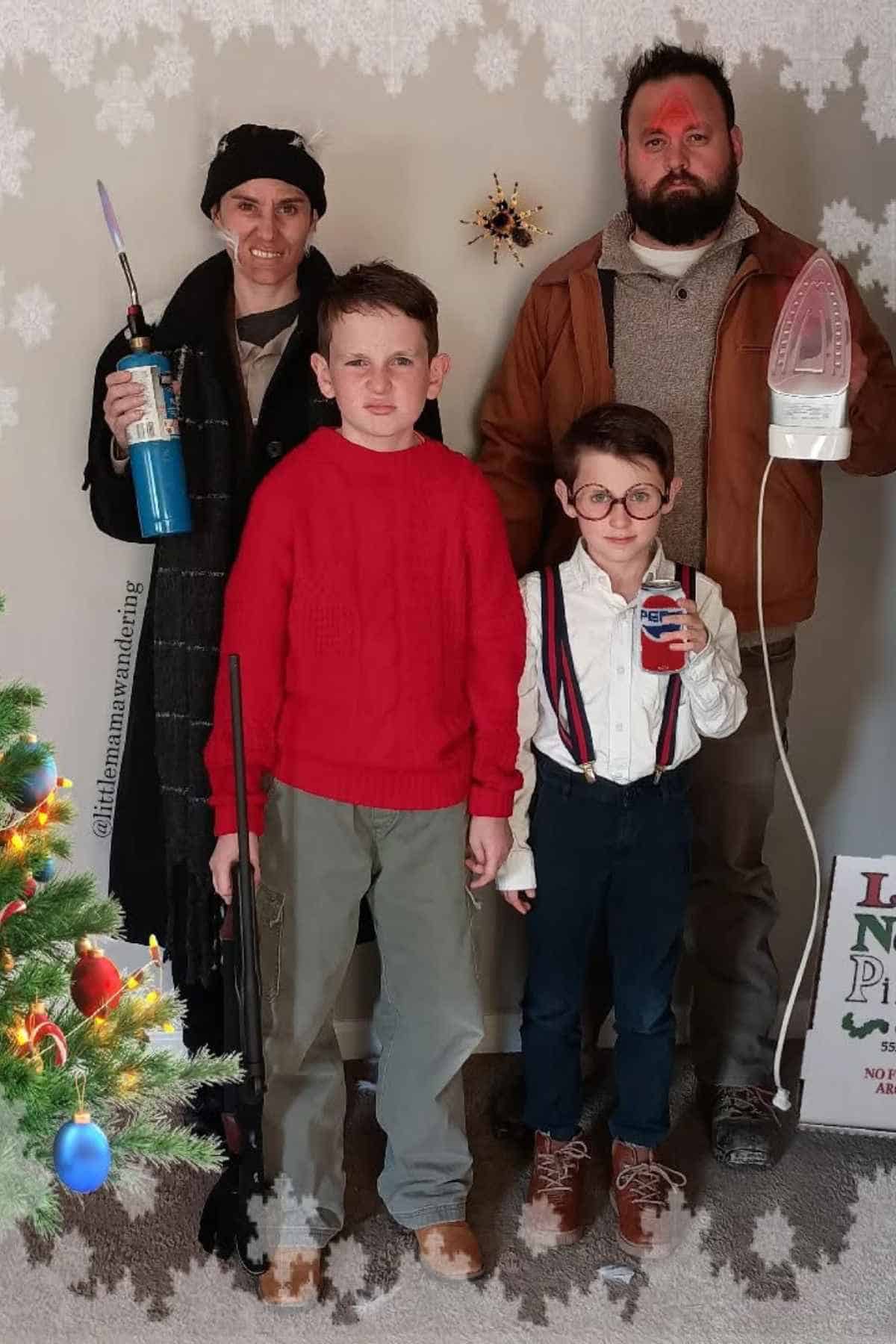 Four people in costumes pose indoors, referencing the movie "Home Alone." The adults hold a torch and iron; the kids wear outfits similar to Kevin and hold a BB gun and aftershave.