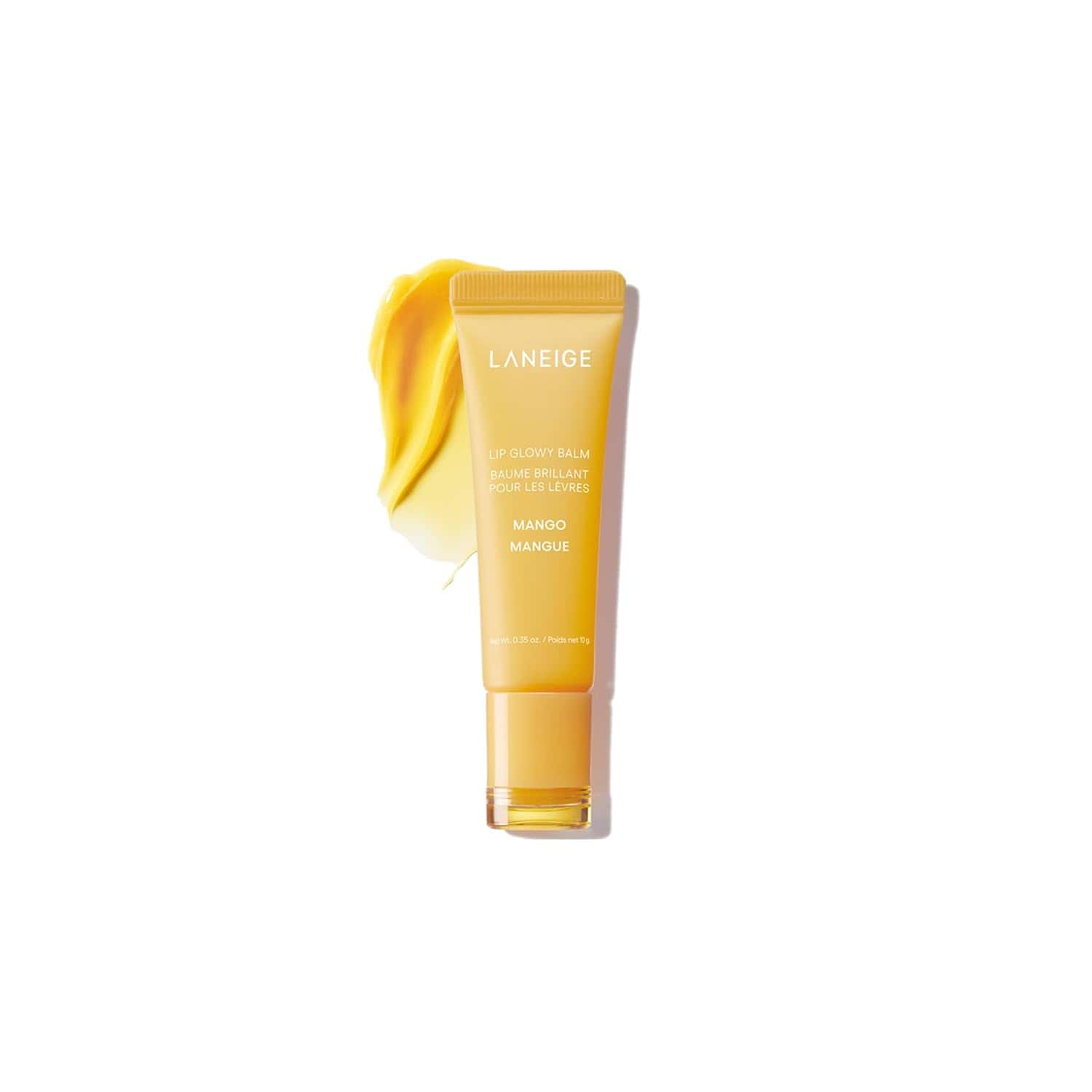 A yellow tube of Laneige Lip Glowy Balm in Mango flavor is shown with a smear of yellow balm beside it on a white background.