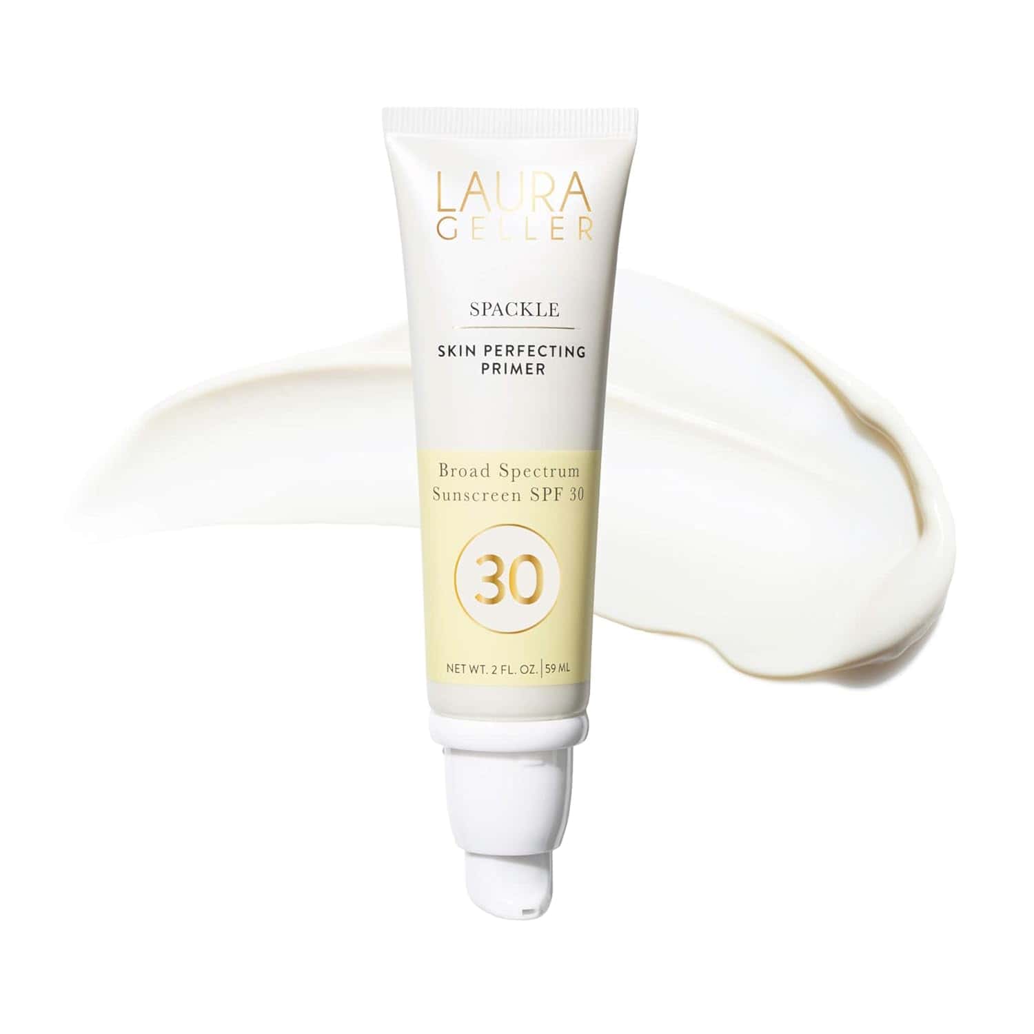 A tube of Laura Geller Spackle Skin Perfecting Primer with SPF 30, shown with a smear of the product in the background.