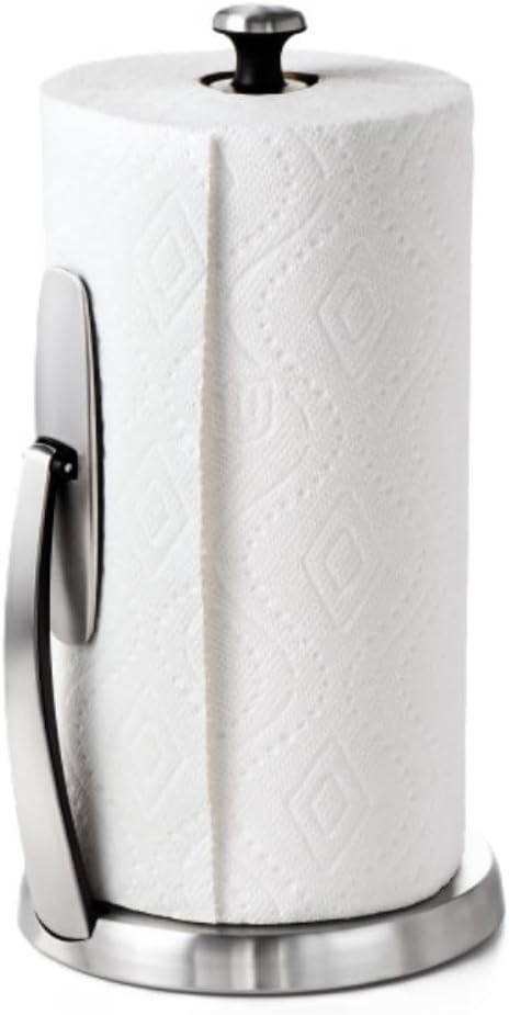 A roll of white paper towels on a stainless steel holder with a vertical arm and round base.